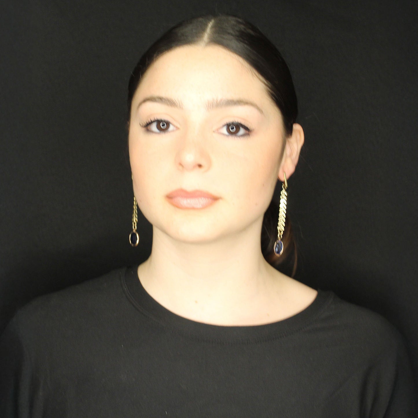 Fashion dangle earrings with transparent multicolor tear drop stones.