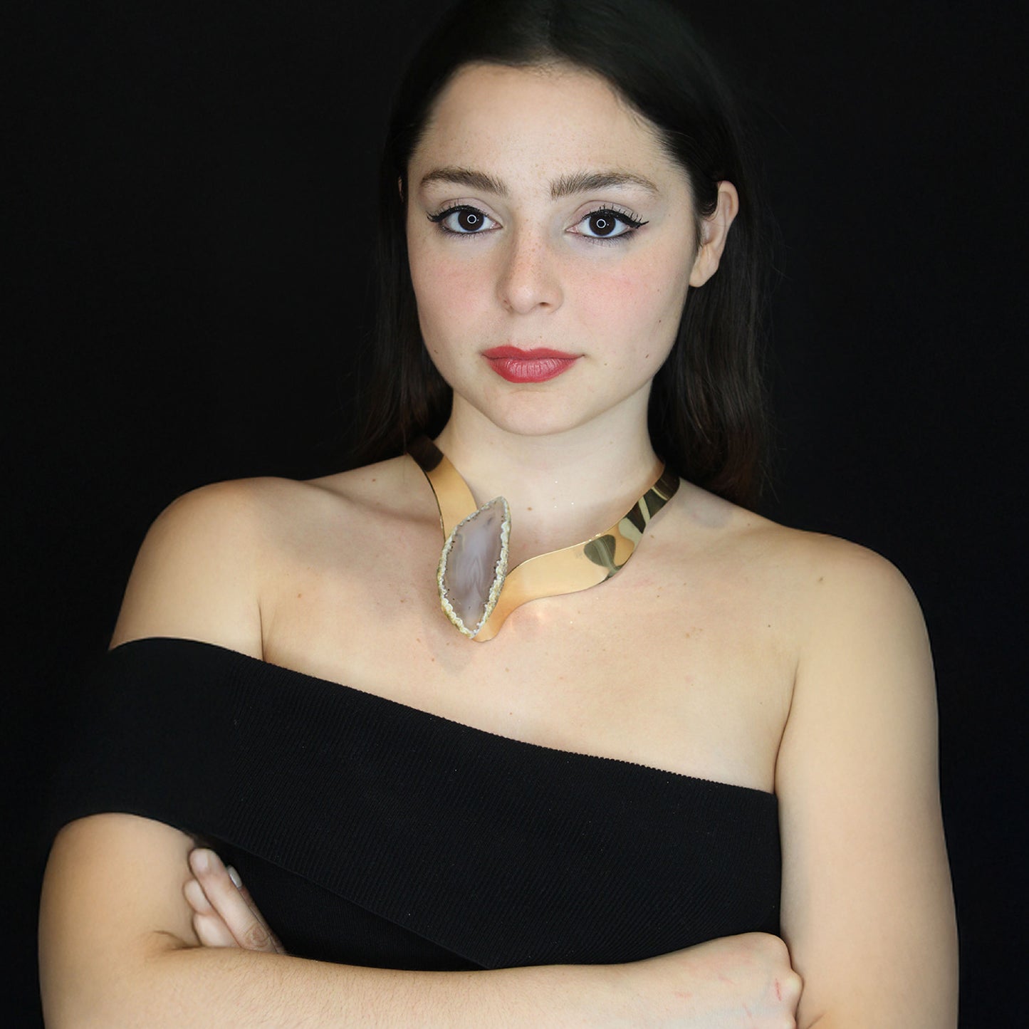 Gold cuff choker necklace with a leaf beige natural glass stone.