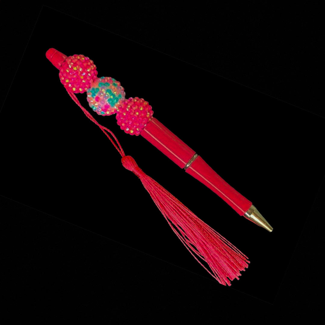 Hot pink pen color with multicolor beads and tassel.