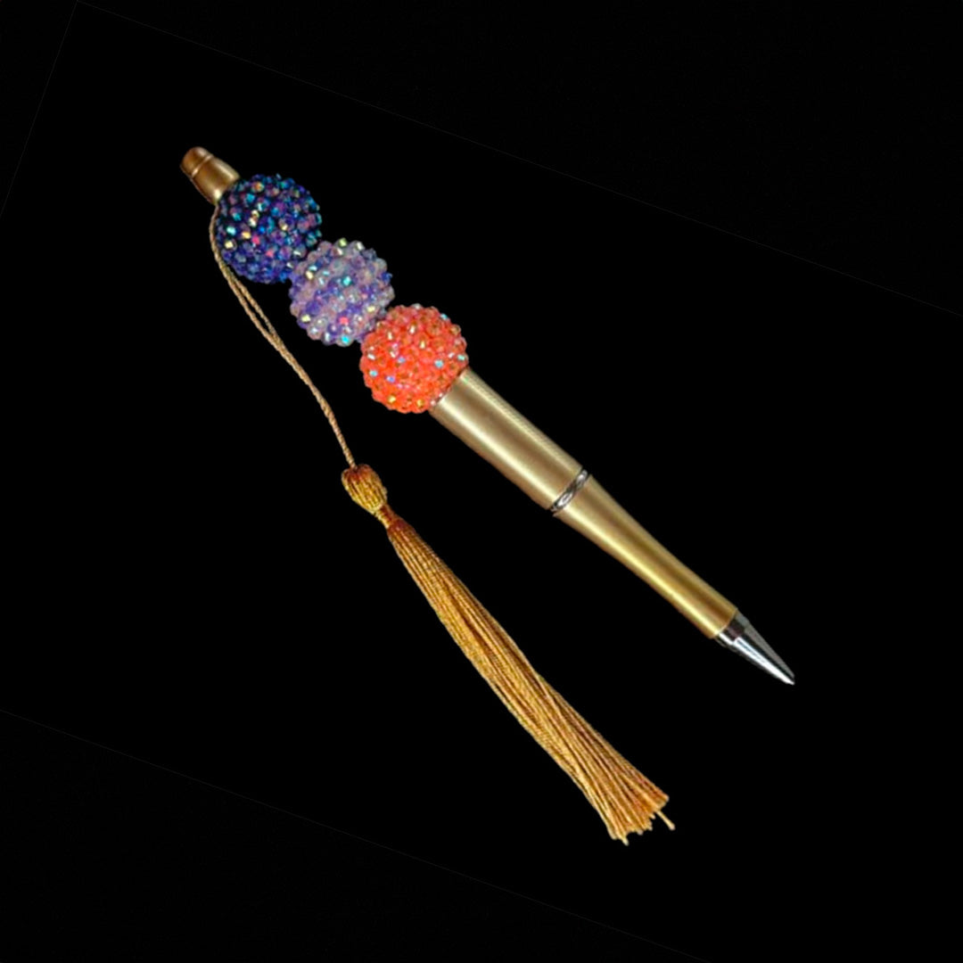Gold pen with a multicolor beads with a tassel