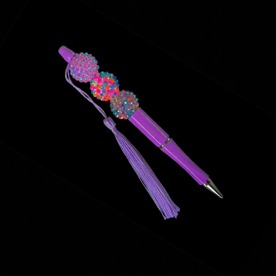 Purple color beaded pen with tassel.