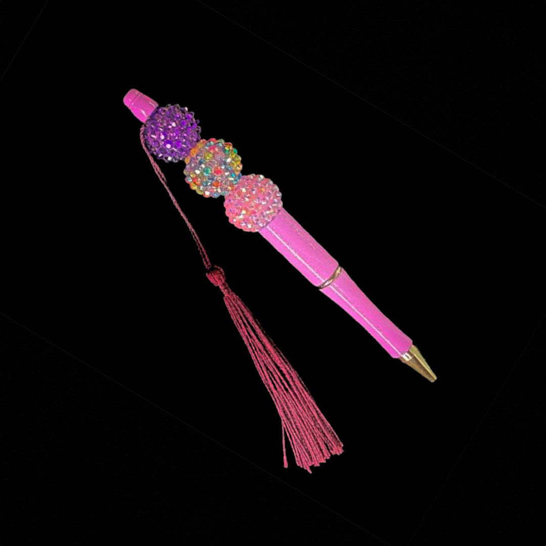 Purple color beaded pen with tassel.